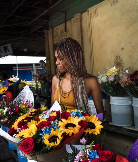 A woman choosing some flowers
